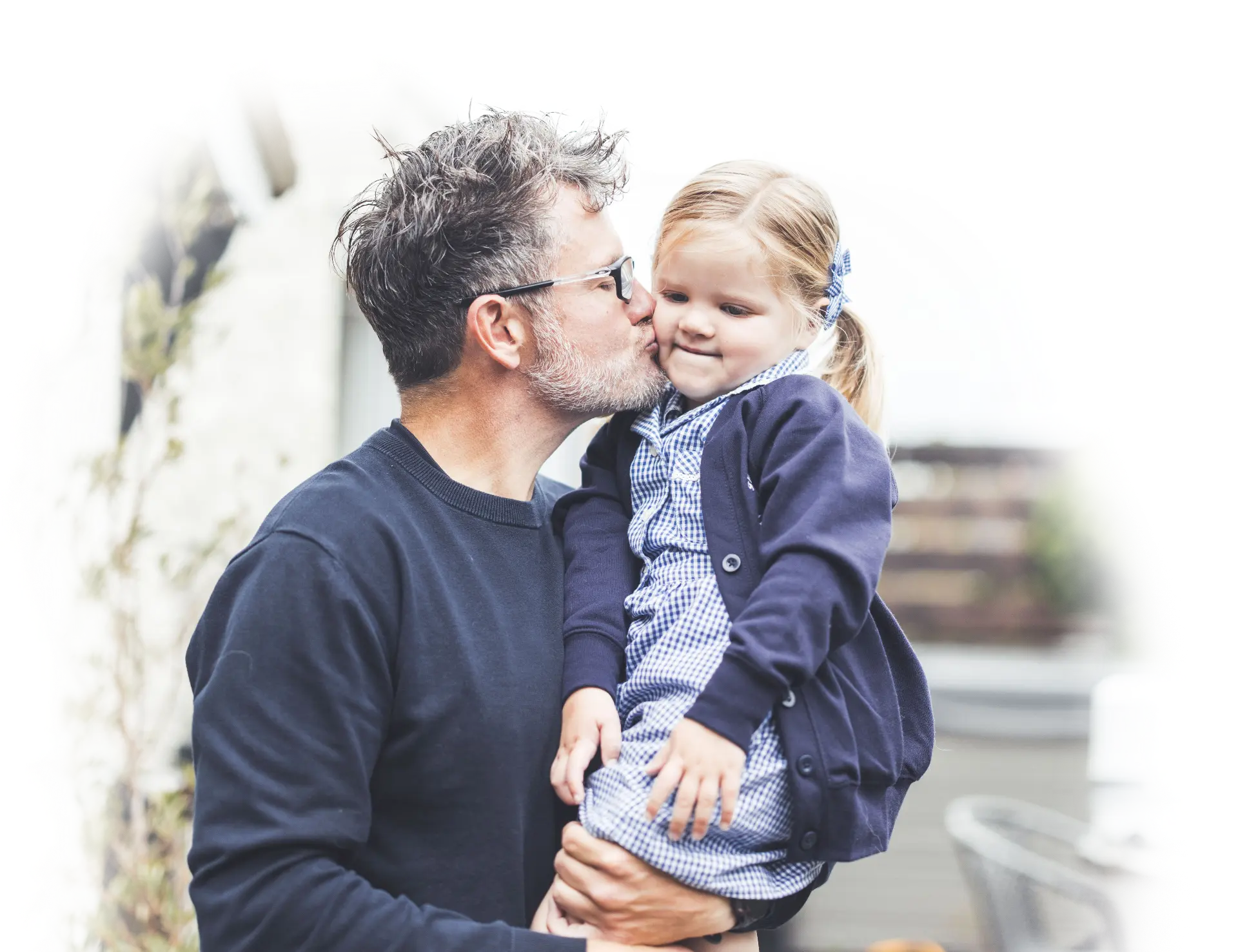 Dan, founder of Dream Creative Media, holding his daughter