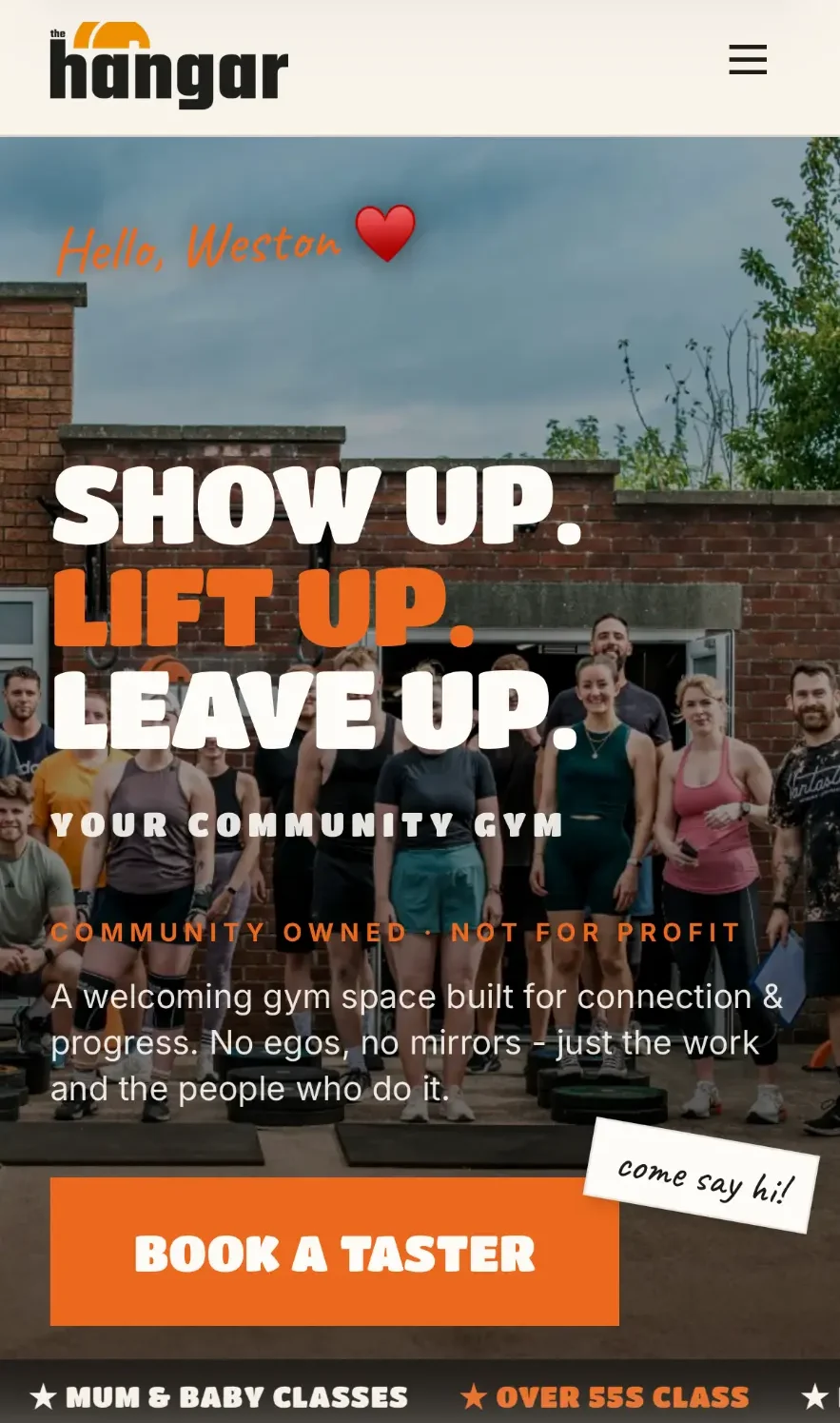 The Hangar community gym website shown on a phone